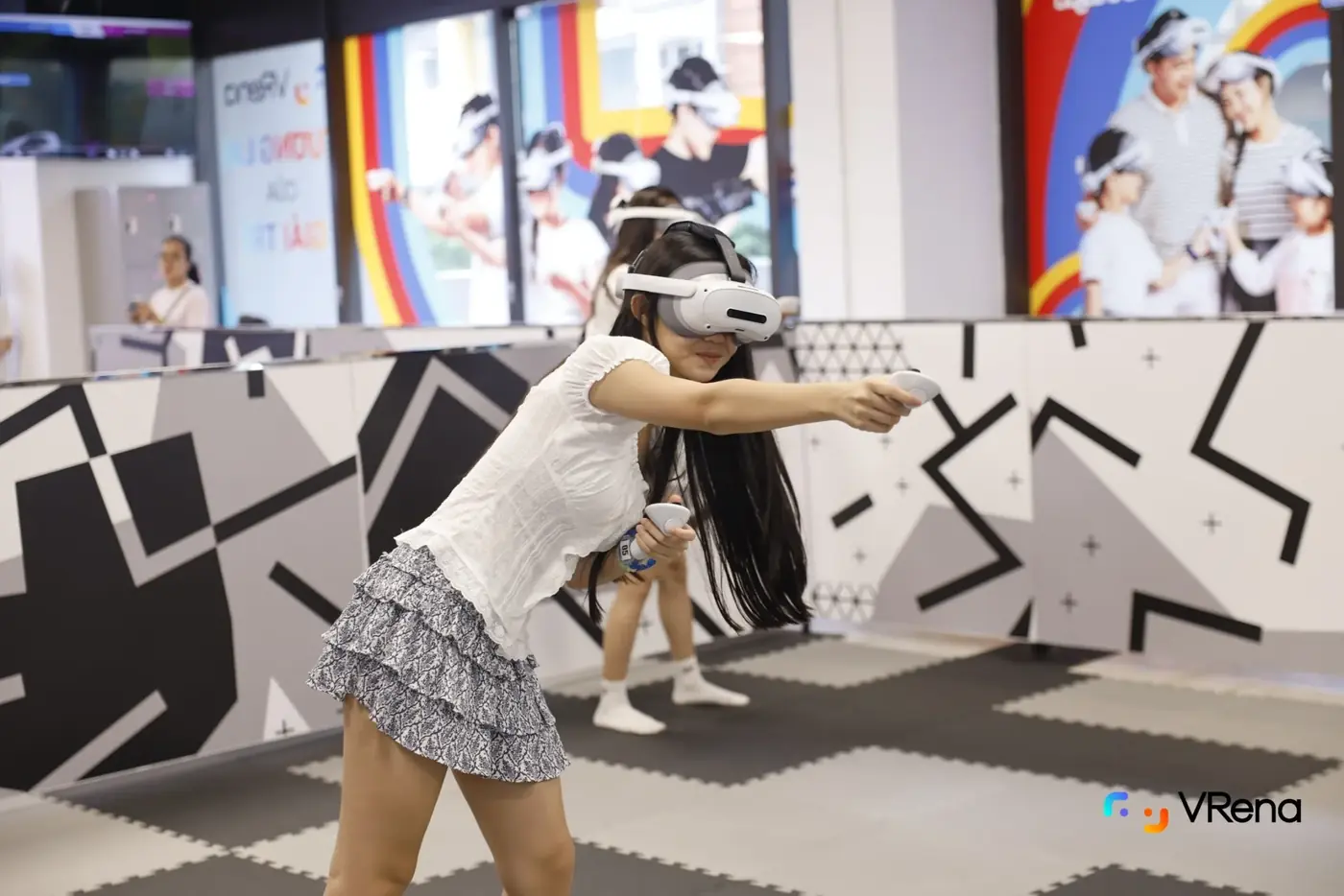 A player in a headset aims in the VRena arena